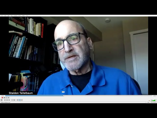Sheldon (Sheli) Teitelbaum in a blue shirt, looking to the side